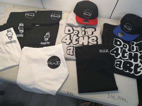 Company merchandise tees and caps