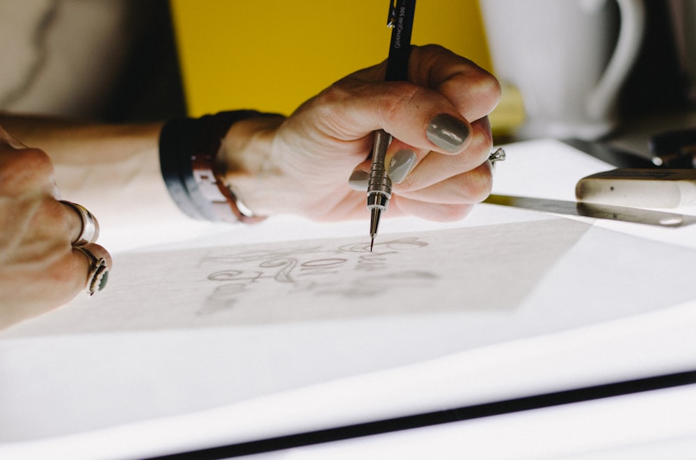 Hand-drawn logo concept on paper