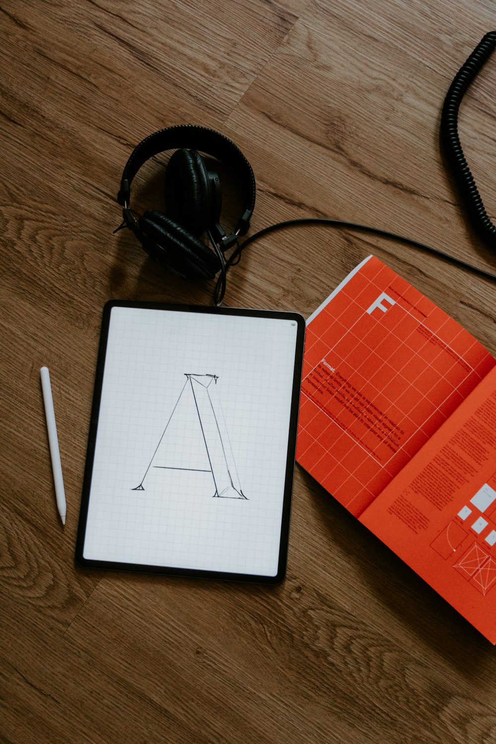 Logo lettering concept sketched on a tablet